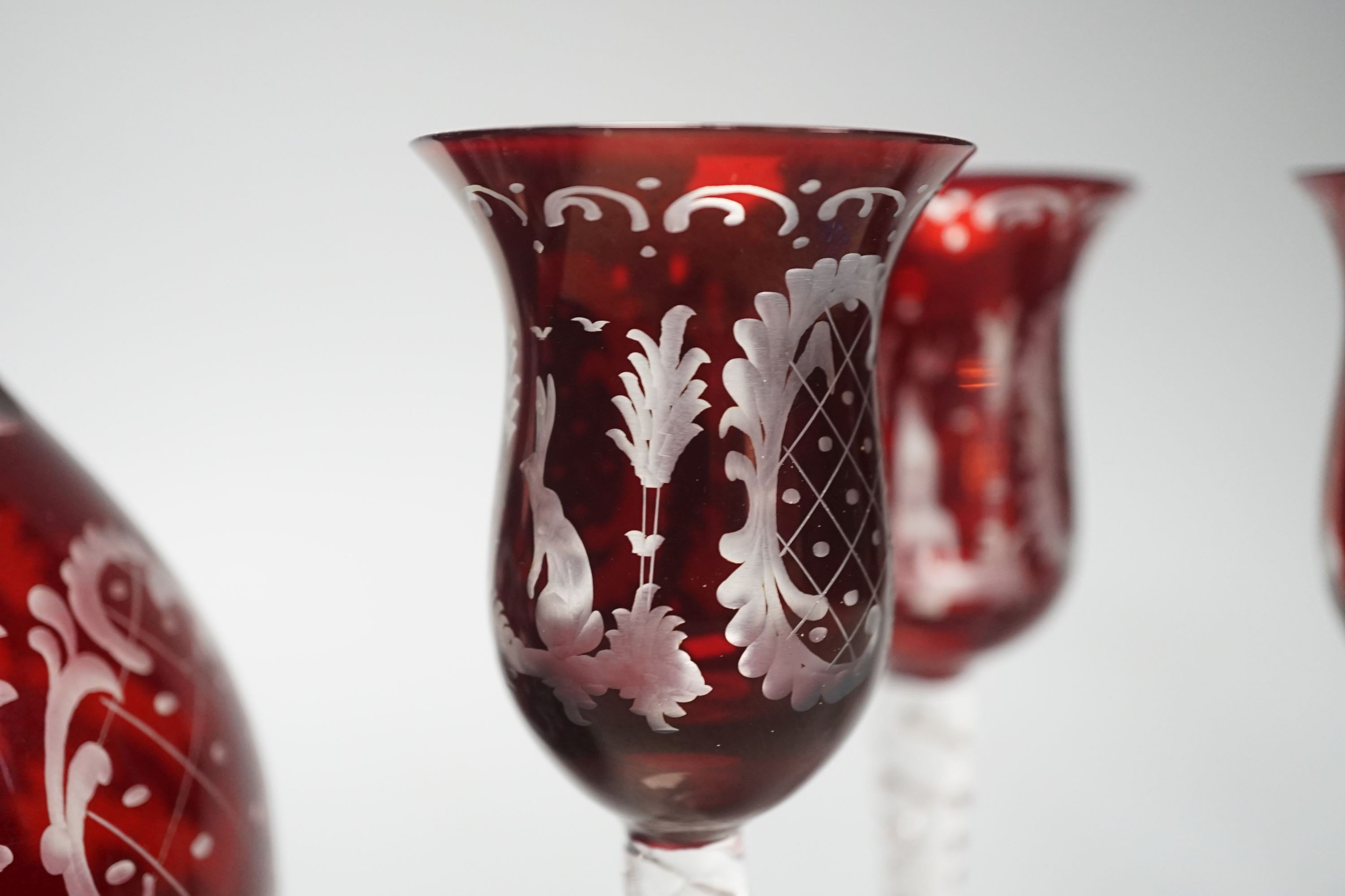 A Bohemian wheel engraved ruby flashed glass decanter and four matching liqueur glasses